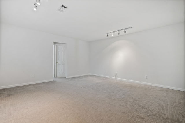 1016 Barkdull St, Houston, TX 77006 - empty room featuring rail lighting and light colored carpet