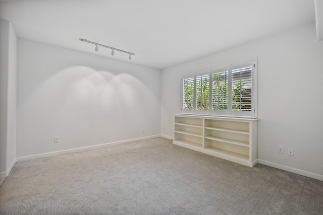 1016 Barkdull St, Houston, TX 77006 - spare room featuring carpet flooring and track lighting