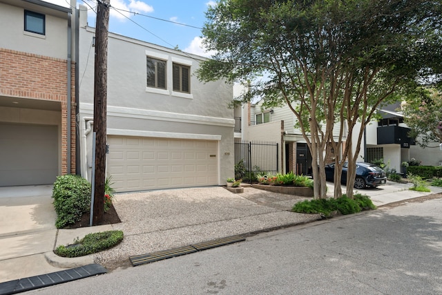 1016 Barkdull St, Houston, TX 77006 - multi unit property with stucco siding, concrete driveway, and an attached garage