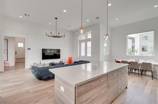 9805 Finch Falls Ln, Houston, TX 77080 - kitchen featuring modern cabinets, healthy amount of natural light, light wood finished floors, and recessed lighting