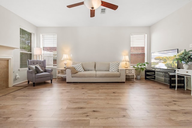 12727 Regal Pine Ln, Houston, TX 77070 - living area with plenty of natural light, light wood-style flooring, and ceiling fan
