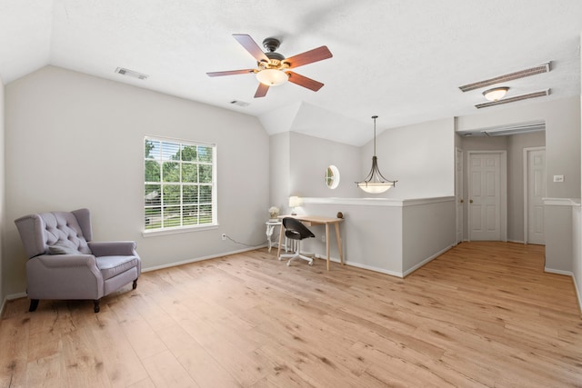 12727 Regal Pine Ln, Houston, TX 77070 - living area featuring vaulted ceiling, wood finished floors, ceiling fan, and attic access