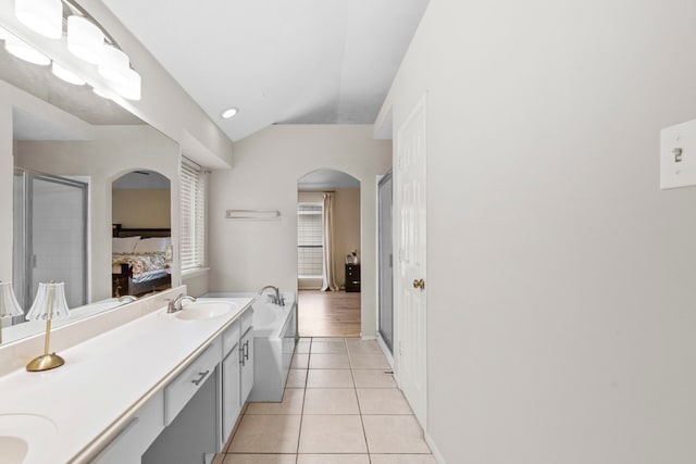 12727 Regal Pine Ln, Houston, TX 77070 - full bath featuring ensuite bath, tile patterned flooring, double vanity, a bath, and a shower stall