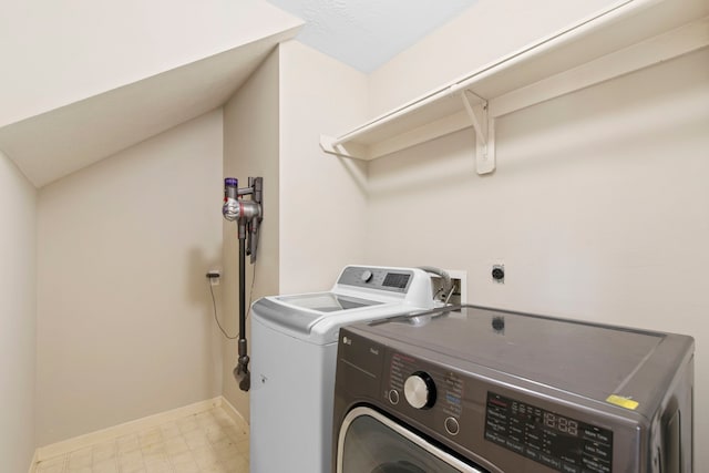 12727 Regal Pine Ln, Houston, TX 77070 - washroom with washing machine and dryer and light flooring