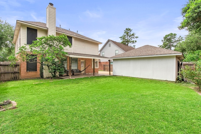 12727 Regal Pine Ln, Houston, TX 77070 - rear view of property featuring a patio and a chimney