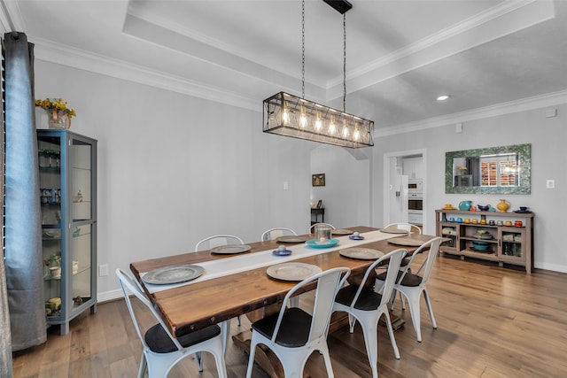 5523 Darschelle Dr, Houston, TX 77069 - dining space with recessed lighting, ornamental molding, light wood finished floors, and a tray ceiling