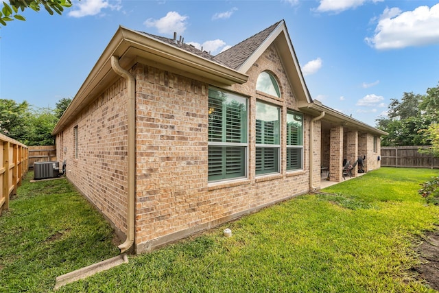 5523 Darschelle Dr, Houston, TX 77069 - view of home's exterior with brick siding, a fenced backyard, and roof with shingles