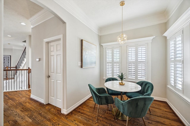 918 Detering St, Houston, TX 77007 - dining space featuring ornamental molding, arched walkways, wood finished floors, stairway, and a chandelier