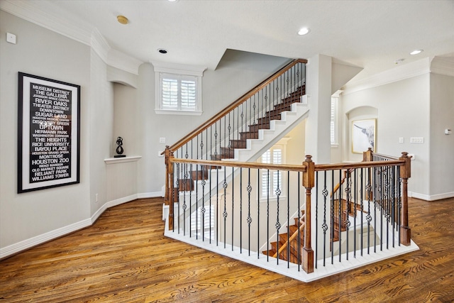 918 Detering St, Houston, TX 77007 - stairs with ornamental molding, wood finished floors, recessed lighting, and arched walkways