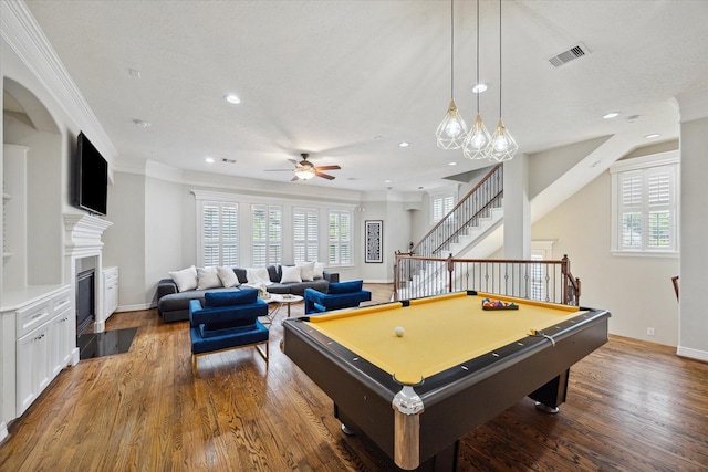 918 Detering St, Houston, TX 77007 - game room with ceiling fan, recessed lighting, wood finished floors, ornamental molding, and a fireplace with flush hearth