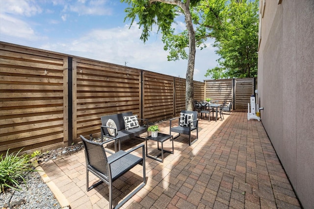 918 Detering St, Houston, TX 77007 - fenced backyard with outdoor dining space, a patio, and an outdoor living space