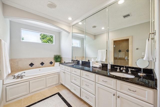 918 Detering St, Houston, TX 77007 - full bathroom featuring inlaid floor details, ornamental molding, double vanity, tile patterned floors, and a bath