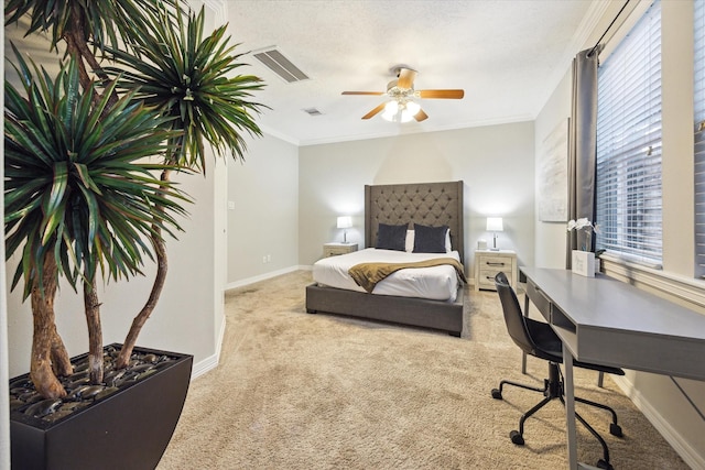 918 Detering St, Houston, TX 77007 - carpeted bedroom featuring an office area, crown molding, ceiling fan, and a textured ceiling