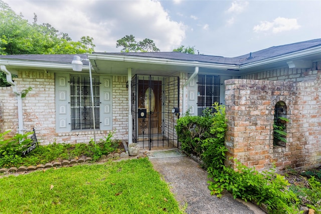 7726 Melanie St, Houston, TX 77016 - entrance to property with brick siding, a porch, and roof with shingles