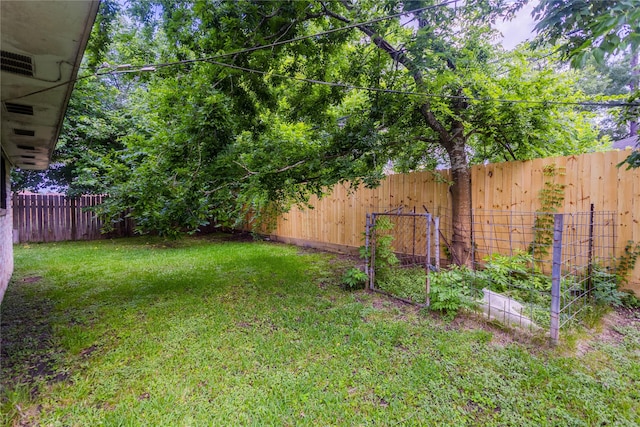 7726 Melanie St, Houston, TX 77016 - fenced backyard with a vegetable garden