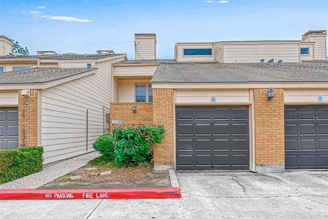 2277 S Kirkwood Rd Unit 906, Houston, TX 77077 - townhome / multi-family property featuring brick siding and a chimney