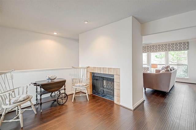 2277 S Kirkwood Rd Unit 906, Houston, TX 77077 - sitting room with a tile fireplace, dark wood-style flooring, and recessed lighting