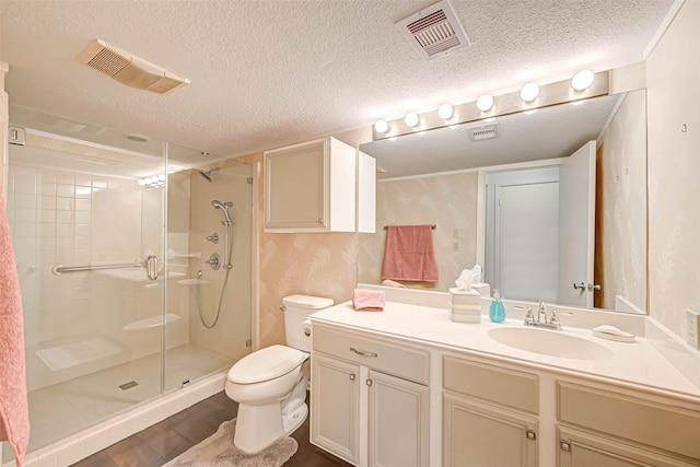 2277 S Kirkwood Rd Unit 906, Houston, TX 77077 - bathroom featuring wallpapered walls, a stall shower, vanity, a textured ceiling, and wood finished floors