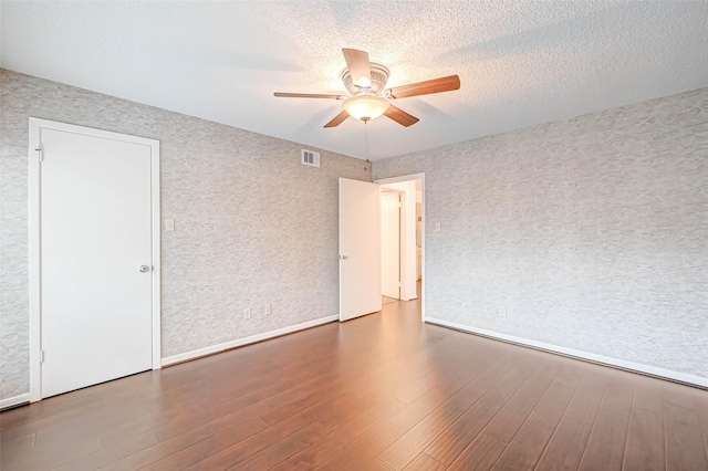 2277 S Kirkwood Rd Unit 906, Houston, TX 77077 - unfurnished room featuring ceiling fan, wood finished floors, and a textured ceiling