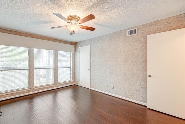 2277 S Kirkwood Rd Unit 906, Houston, TX 77077 - unfurnished room featuring a ceiling fan, dark wood-style floors, and a textured ceiling