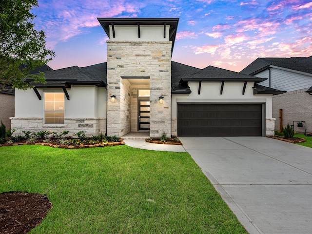 14328 Moonlit Creek Ct, Montgomery, TX 77316 - view of front of house featuring stone siding, stucco siding, a garage, and concrete driveway