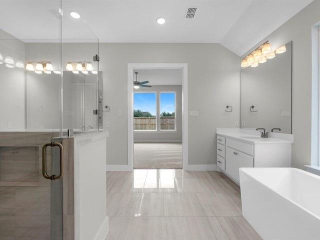 14328 Moonlit Creek Ct, Montgomery, TX 77316 - full bathroom featuring a freestanding tub, vanity, ceiling fan, a shower stall, and vaulted ceiling
