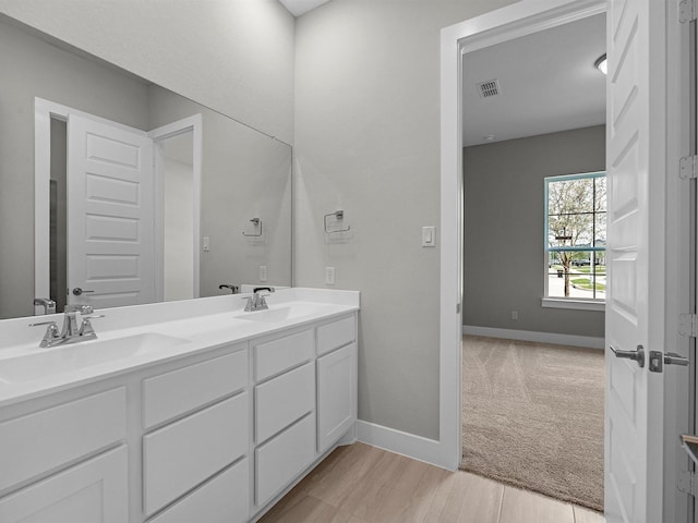 14328 Moonlit Creek Ct, Montgomery, TX 77316 - full bathroom with double vanity and wood finished floors