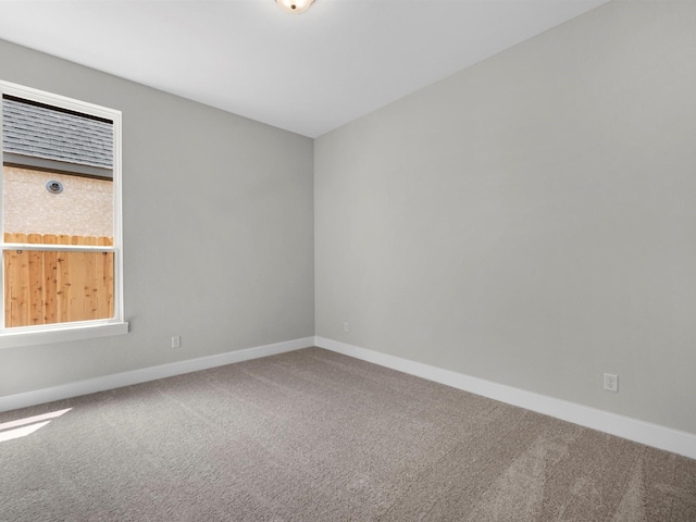 14328 Moonlit Creek Ct, Montgomery, TX 77316 - spare room featuring carpet and baseboards
