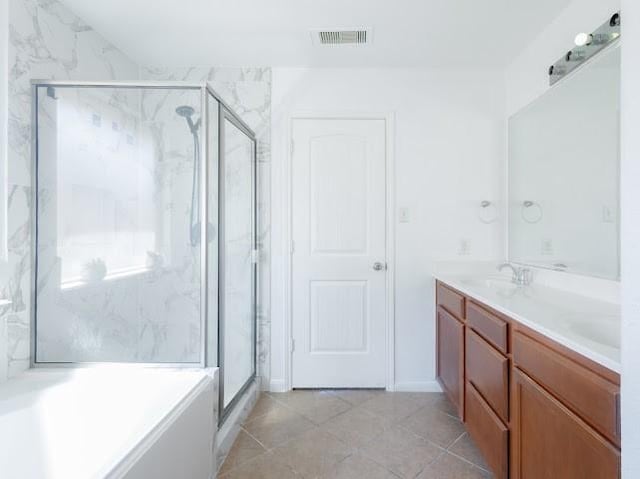 14110 Long Meadow Dr, Houston, TX 77047 - full bathroom with double vanity, a marble finish shower, a garden tub, and tile patterned floors