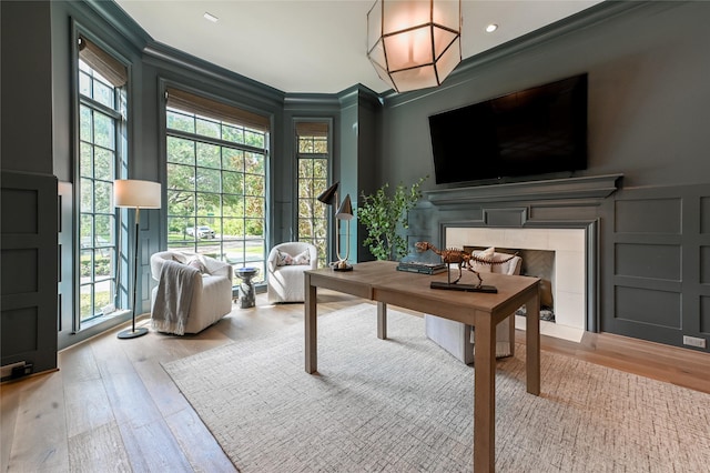 3028 Locke Ln, Houston, TX 77019 - office space with crown molding, wood finished floors, a fireplace, and a decorative wall