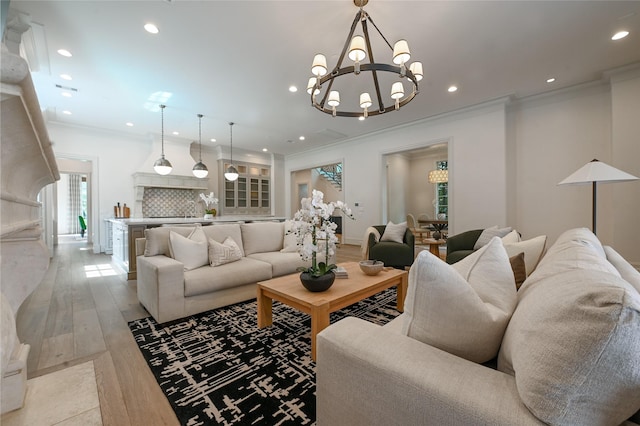 3028 Locke Ln, Houston, TX 77019 - living area featuring ornamental molding, light wood-style floors, recessed lighting, and a chandelier