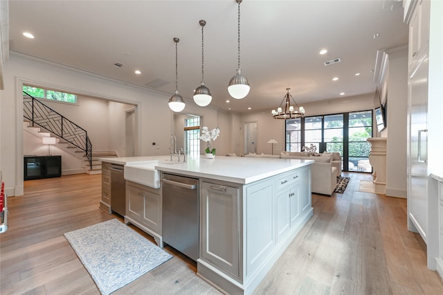 3028 Locke Ln, Houston, TX 77019 - kitchen featuring dishwasher, open floor plan, healthy amount of natural light, light countertops, and recessed lighting