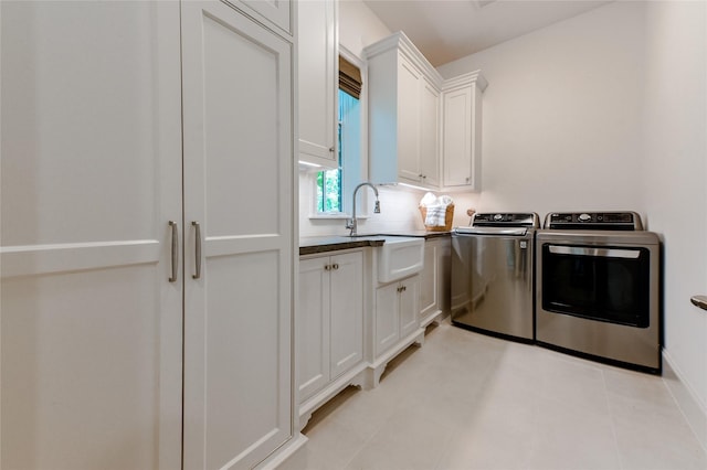 3028 Locke Ln, Houston, TX 77019 - laundry area with washer and clothes dryer and cabinet space