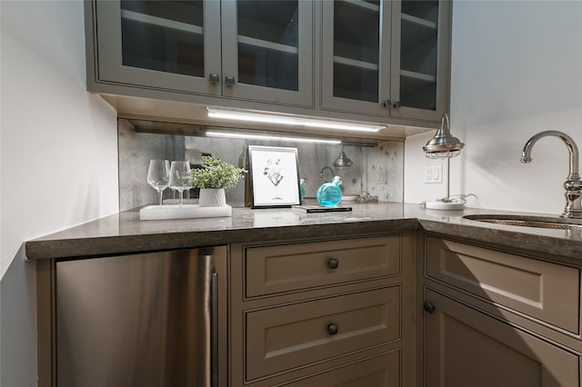 3028 Locke Ln, Houston, TX 77019 - bar featuring stainless steel fridge and decorative backsplash