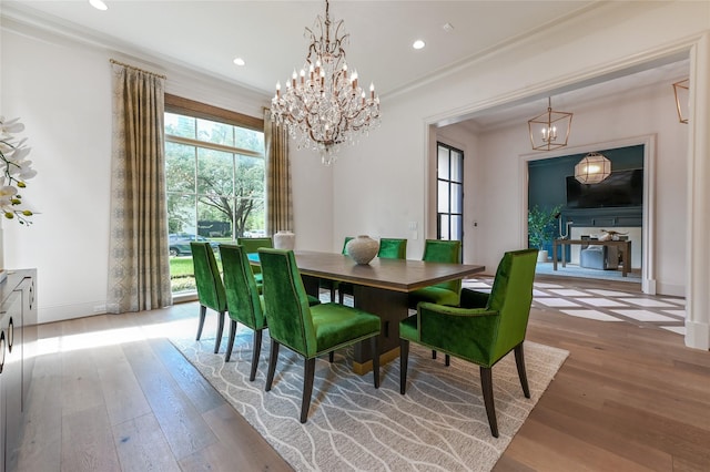 3028 Locke Ln, Houston, TX 77019 - dining space featuring a chandelier, wood-type flooring, crown molding, and recessed lighting