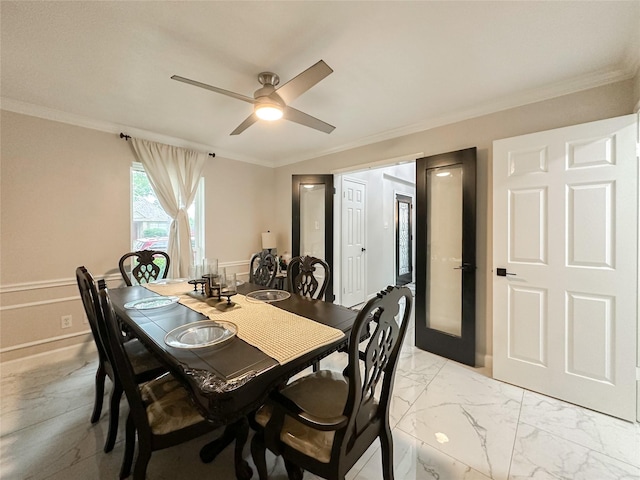 7902 Granite Ridge Ln, Houston, TX 77095 - dining area featuring a ceiling fan, crown molding, light marble finish flooring, and wainscoting