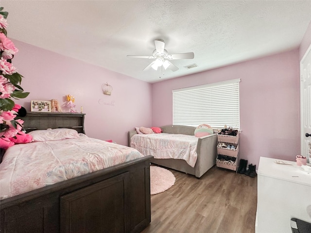7902 Granite Ridge Ln, Houston, TX 77095 - bedroom featuring light wood-style flooring and ceiling fan