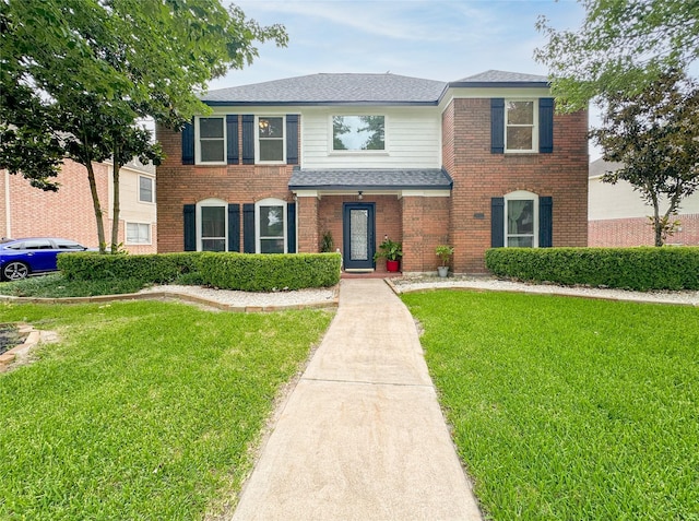 7902 Granite Ridge Ln, Houston, TX 77095 - view of front of property featuring a front lawn, brick siding, and a shingled roof