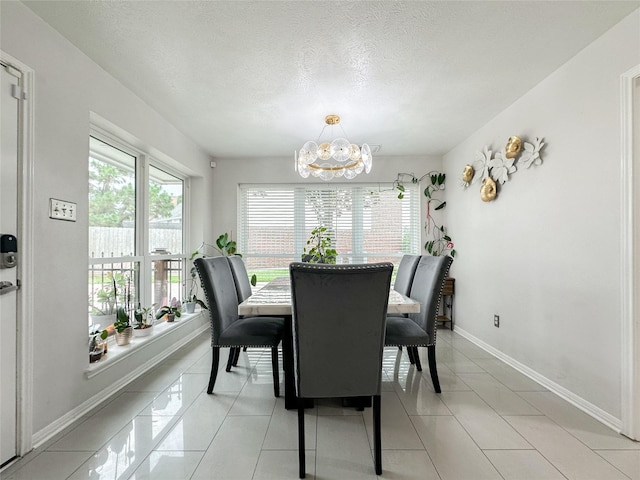 7902 Granite Ridge Ln, Houston, TX 77095 - dining room with a chandelier, a textured ceiling, and light tile patterned floors