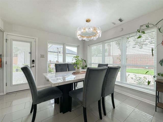 7902 Granite Ridge Ln, Houston, TX 77095 - dining area featuring a chandelier and light tile patterned flooring