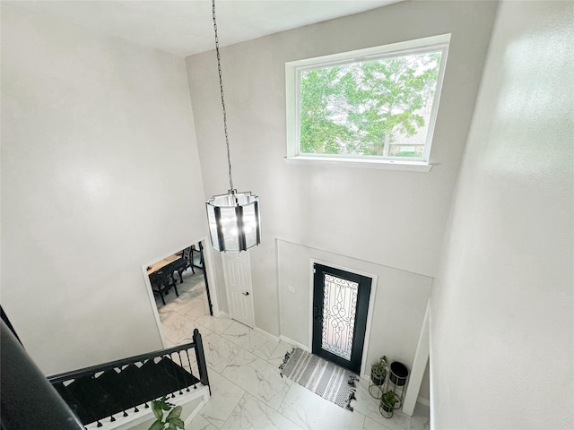 7902 Granite Ridge Ln, Houston, TX 77095 - entrance foyer featuring light marble finish flooring and baseboards