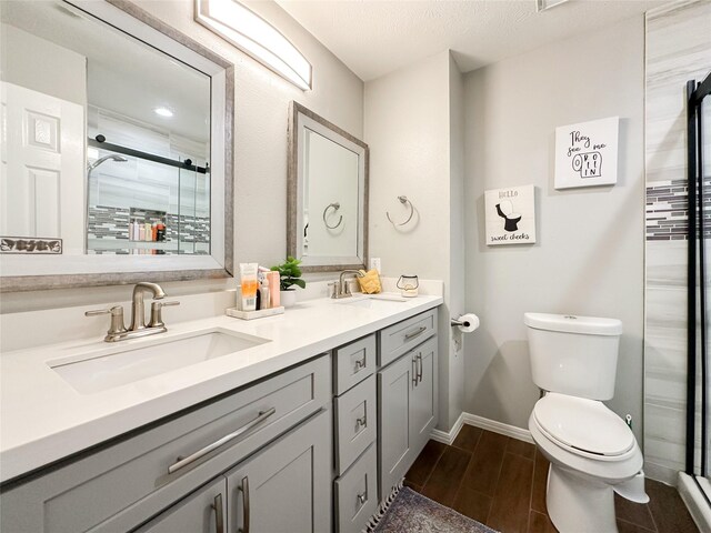 7902 Granite Ridge Ln, Houston, TX 77095 - full bathroom with double vanity, a stall shower, and wood finish floors