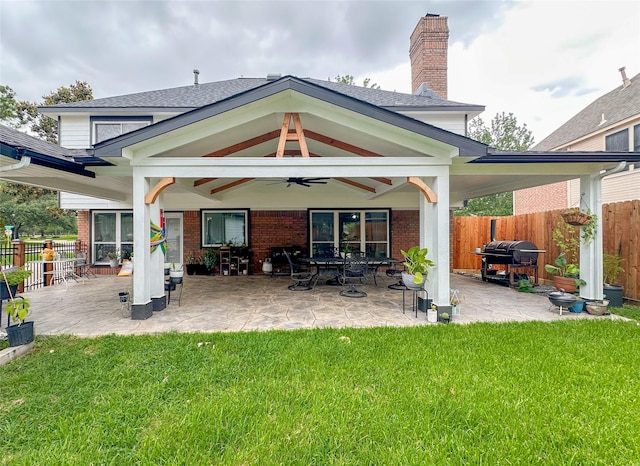 7902 Granite Ridge Ln, Houston, TX 77095 - back of house featuring brick siding, a fenced backyard, ceiling fan, and a chimney