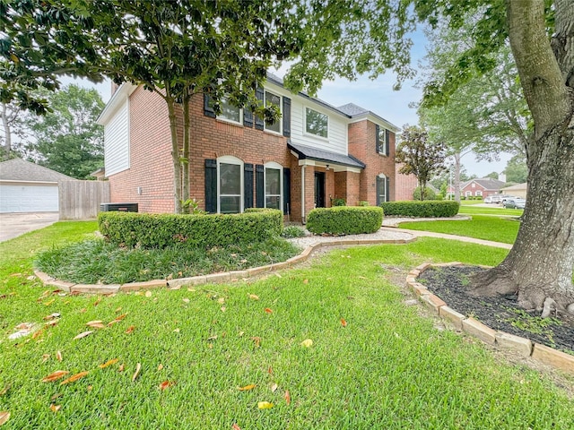 7902 Granite Ridge Ln, Houston, TX 77095 - view of front of house featuring brick siding, a front lawn, and a detached garage