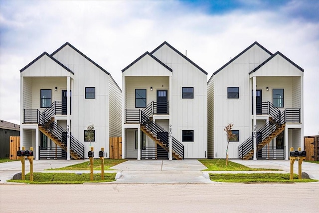 9804-9808 Pelsey St, Houston, TX 77029 - modern farmhouse featuring stairs and board and batten siding