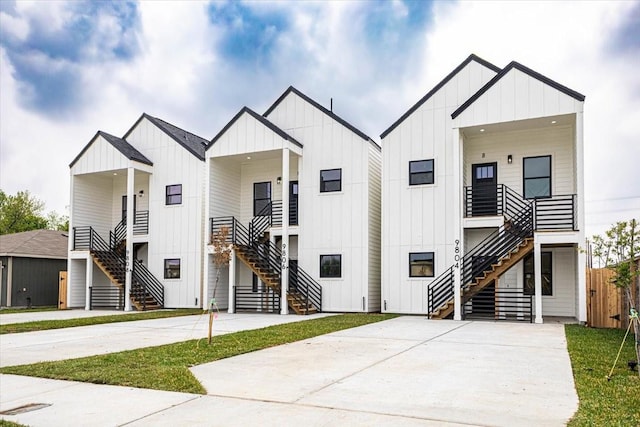 9804-9808 Pelsey St, Houston, TX 77029 - modern farmhouse style home featuring stairs, board and batten siding, and driveway