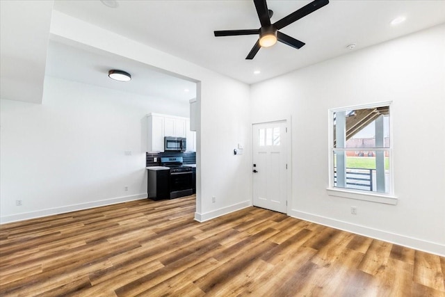 9804-9808 Pelsey St, Houston, TX 77029 - foyer with a ceiling fan, light wood-style floors, and recessed lighting