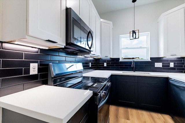 9804-9808 Pelsey St, Houston, TX 77029 - kitchen featuring range with electric cooktop, dishwashing machine, light wood finished floors, and white cabinetry