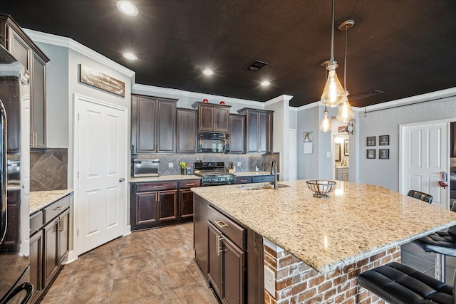 29513 Salem Fields Dr, Spring, TX 77386 - kitchen featuring black microwave, stove, crown molding, a breakfast bar, and backsplash