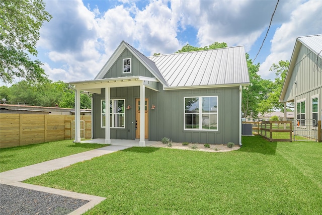 741 Pecan St, New Ulm, TX 78950 - rear view of property with board and batten siding and a metal roof